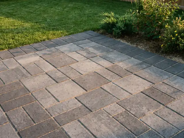 A newly laid paving stone patio with a soldier course border in Saskatoon, SK
